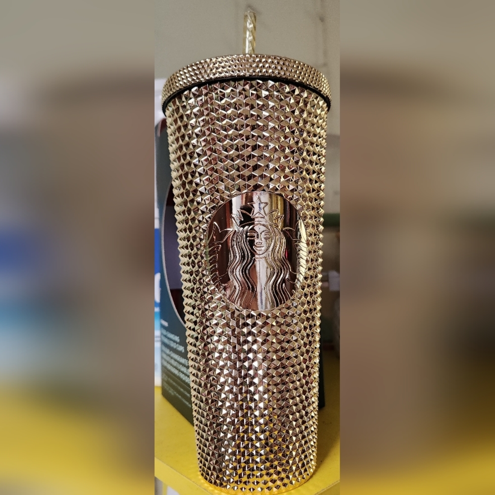 Gold studded Starbucks cup